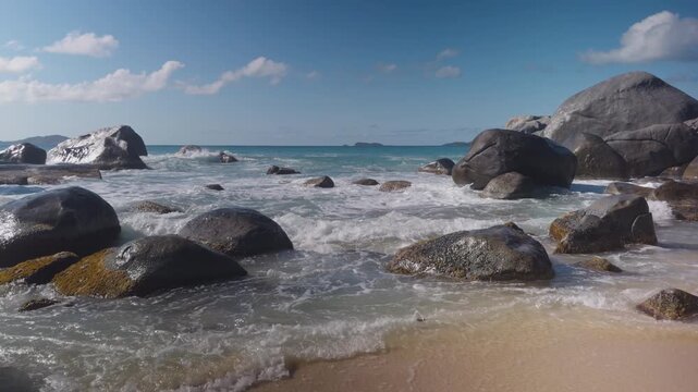 Turquoise waves surge around granite boulders at The Baths in Virgin Gorda.