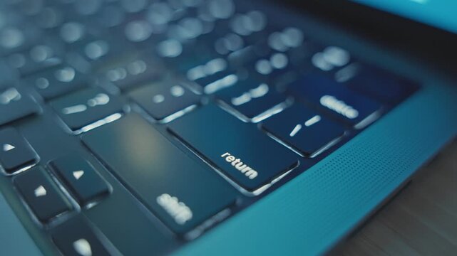 Close up of various clicks on Return or Enter key button on laptop keyboard. Dark office desk or home. Person or hacker presses and pushes to start and initiate task action entering into app software