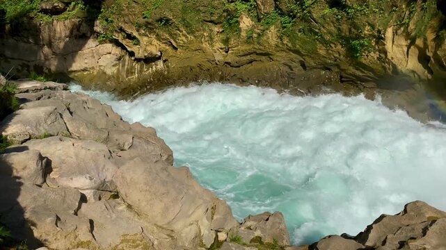 Cinematic shot of the spectacular Cascadas Las Nubes in Chiapas, Mexico, featuring stunning turquoise-blue water flowing over rocky cascades in the lush jungle