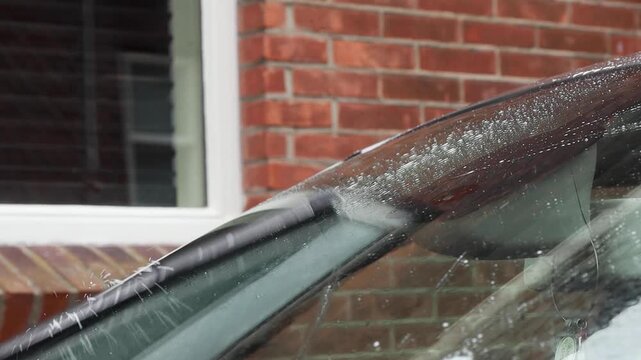 Video of washer fluid being used with windshield wipers.
