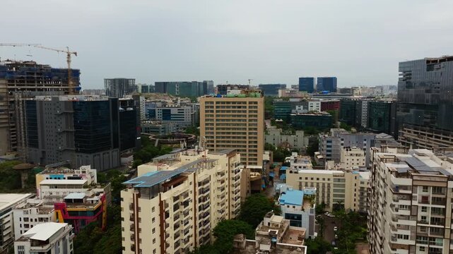 Quiescent Heights apartments with Westin hotel building, corporate offices and Feather Roundabout at mindspace, madhapur, hyderabad, telangana, india. day time, crane shot, drone shot, 4k.