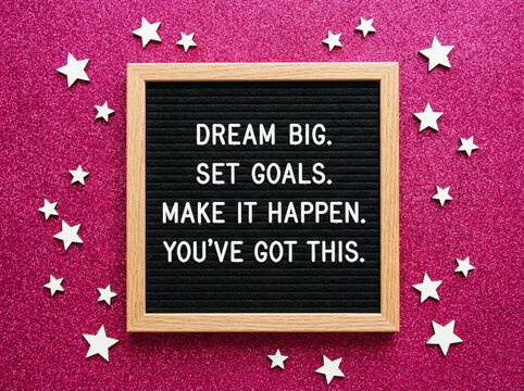 Inspirational quote on a felt letter board with pink glitter background