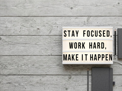 Light box with motivational quote on a wooden background