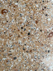 Fototapeta premium Encimera cocina mármol granito y piedra cuarcita granulado colores puntos y vetas marrón, blanco y negro mineral natural pulido brillante