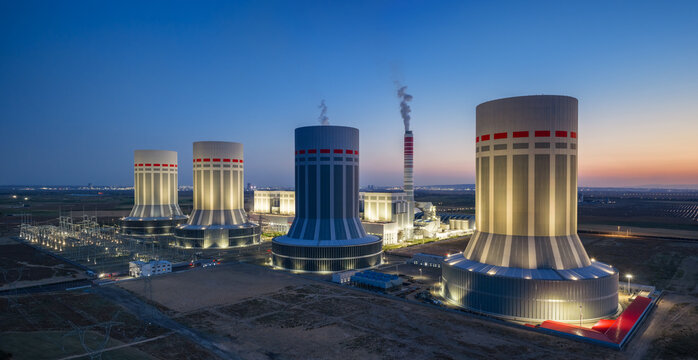 Illuminated Ultra-Supercritical Coal-Fired Power Plant with Cooling Towers at Twilight