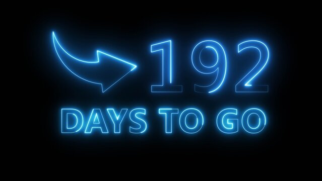 Neon blue light timer graphic counting down one hundred ninety two days to go on black wall.