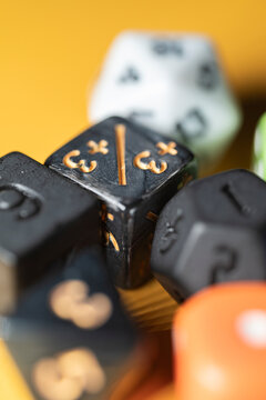 Detailed view of custom polyhedral dice with selective focus on numbers The Concept of chance and roleplaying