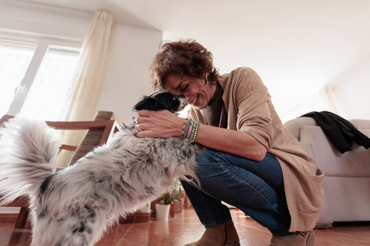 Woman enjoying affectionate moment with her pet dog