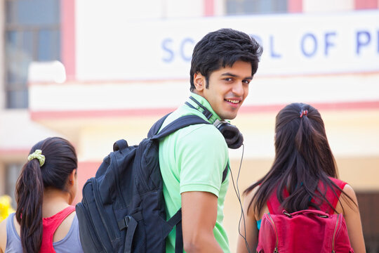 Portrait of a male college student looking back