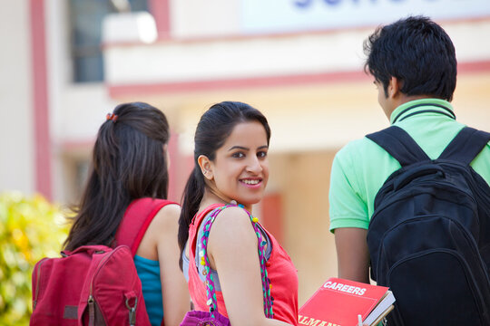 Portrait of a female college student looking back