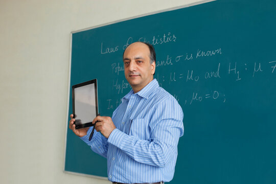Teacher teaching with digital tablet