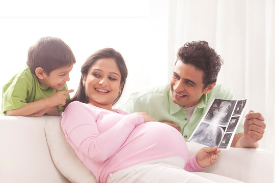 Family looking at ultrasound scans
