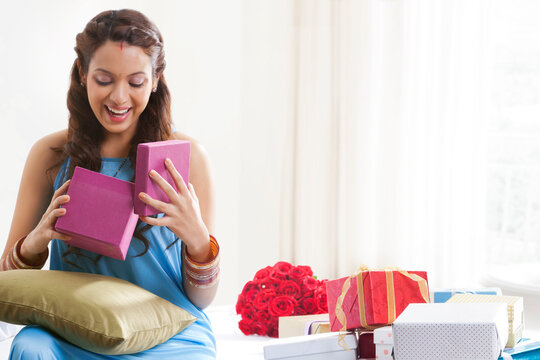 Woman opening a gift box