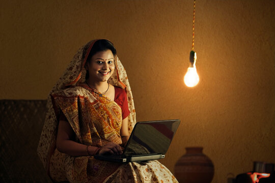 Portrait of rural woman with laptop