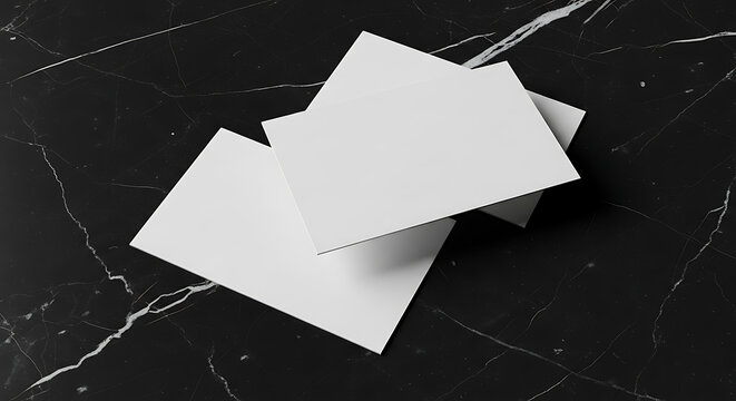 Two Blank Matte White Business Cards Stacked on a Luxury Black Marble Background Surface