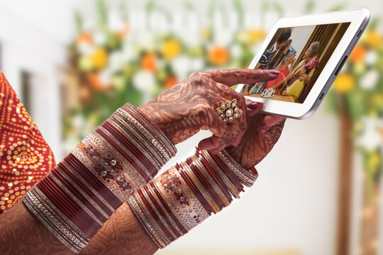 Close-up of a brides hand using tablet computer