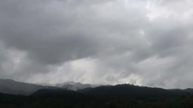 Beautiful cloud formations preceding the rain, covering Doi Luang Chiang Dao mountain in Chiang Dao district, Chiang Mai province