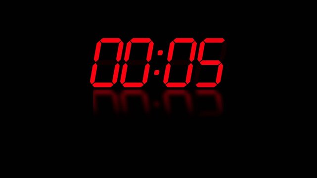 A glowing red digital timer display shows the five second mark against a dark surface where the numerals are reflected clearly to indicate that the final moments of a countdown are now occurring