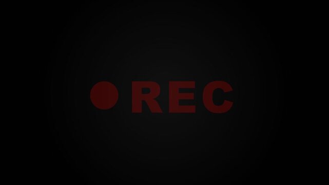 A glowing red indicator light pulses on a dark screen to signal that a digital cinema camera is currently capturing high quality video footage during an ongoing professional broadcast production