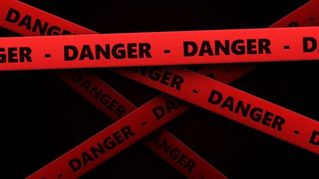 Multiple overlapping strips of vibrant red caution tape displaying bold black lettering warn of significant physical harm while preventing unauthorized entry into a restricted area within