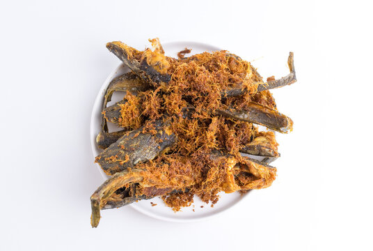 Crispy deep fried catfish with savory crunchy topping on white plate isolated on white background