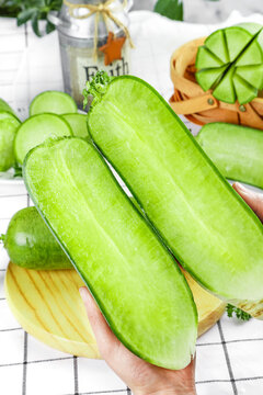 Fresh Green Cucumbers in Hands - Healthy Crisp Vegetables for Kitchen Cooking