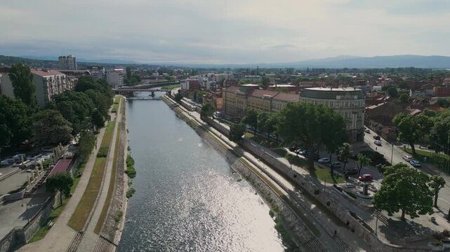 Aerial view flying over the nisava river in nis city, serbia