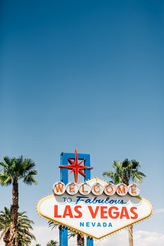 Iconic Welcome to Las Vegas sign against blue sky