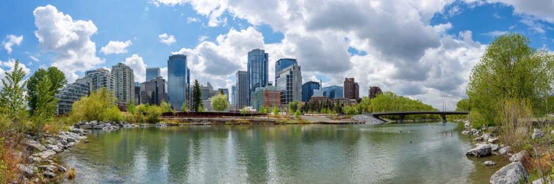 Panoramic Calgary skyline view from city park riverfront