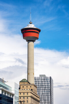 Calgary iconic Tower with city buildings against a blue sky