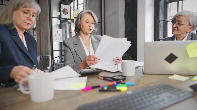Women in business, three senior ladies discussing contract and startup in office . Chief accountant and financial director in boardroom, negotiation with boss of company, teamwork and communication