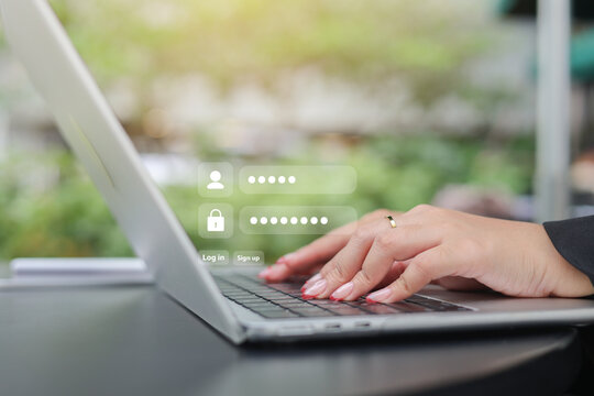 close up businesswoman hand type on laptop to access account on website by input username and password at office for security system of business technology concept