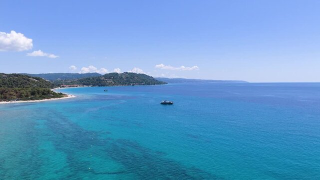 Turquoise waters of Possidi Beach stretch toward