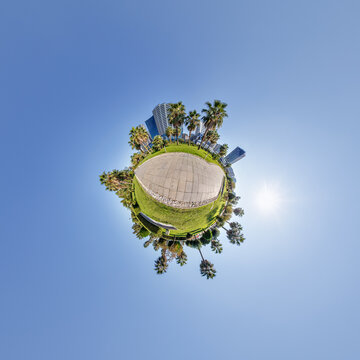 simple little tiny planet without buildings in blue sky with sun and beautiful clouds. Transformation of spherical panorama 360 degrees. Spherical abstract aerial view. Curvature of space.