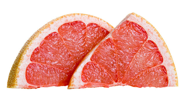 Two juicy grapefruit slices with pink flesh and textured rind