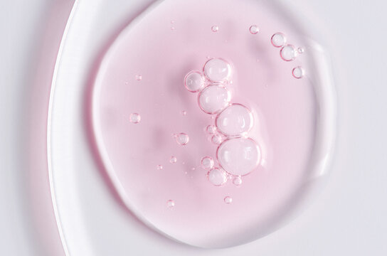 Pink cosmetic product for skin care. A serum or body gel or a moisturizer.