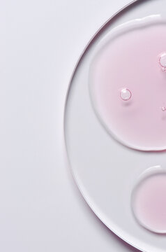 Pink cosmetic product for skin care. A serum or body gel or a moisturizer.