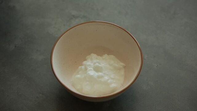 Fresh Cottage Cheese in Ceramic Bowl High Angle Close Up