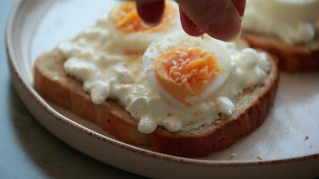 Healthy Toast with Cottage Cheese, Sliced Boiled Egg, and Sesame Seeds Close Up
