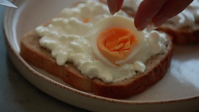 Healthy Toast with Cottage Cheese, Sliced Boiled Egg, and Sesame Seeds Close Up