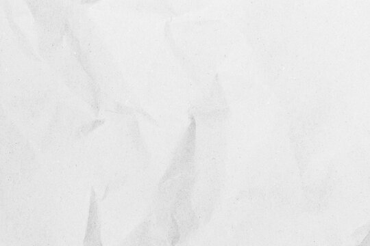 White recycled craft paper texture as background. Grey paper texture, Old vintage page or grunge vignette of old newspaper. Pattern rough art creased grunge letter. Hardboard with copy space for text.