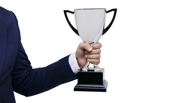 Man in suit holding silver trophy cup with black handles