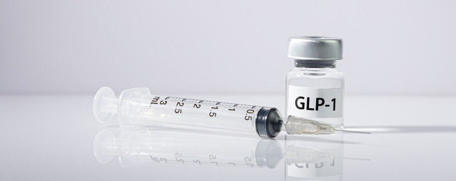 Hopeful medical weight management treatment vial with clear plastic syringe offering modern clinical healthcare solution