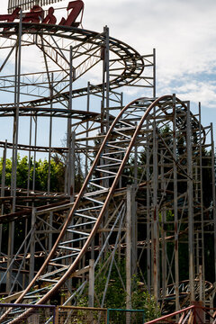 View of the metal structure of a roller coaster in an amusement park with trees in the background in Elektrenai, Vilnius County, Lithuania.