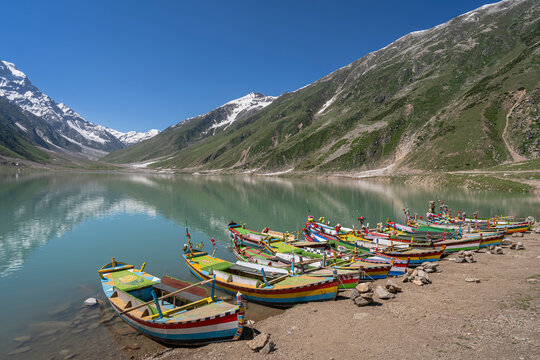 Scenic mountain landscape of Saiful Muluk lake with colorful boats near Naran, Kaghan valley, Khyber Pakhtunkhwa, Pakistan