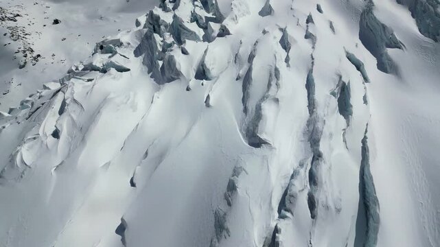 Aerial view of deep crevasses and icy textures on the glacier near Zermatt, Wallis, Switzerland.