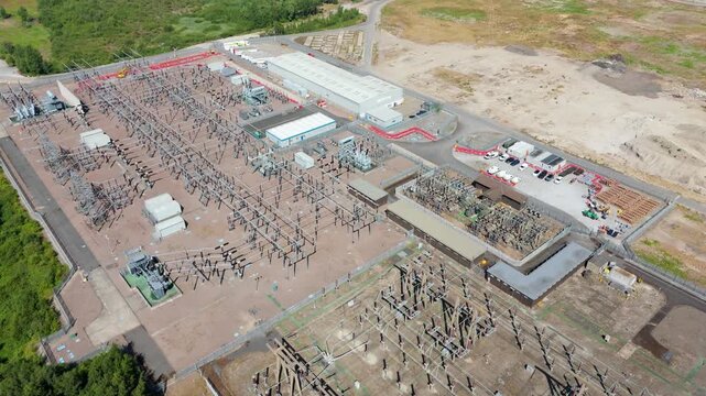 Aerial view of the National Grid Thorpe Marsh Substation featuring electrical infrastructure and transformers in an industrial landscape in Barnby Dun, England, United Kingdom.