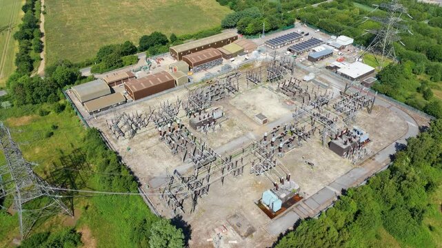 Aerial view of National Grid Thorpe Marsh Substation featuring electrical transformers and power lines in the rural landscape of Barnby Dun, England, United Kingdom.
