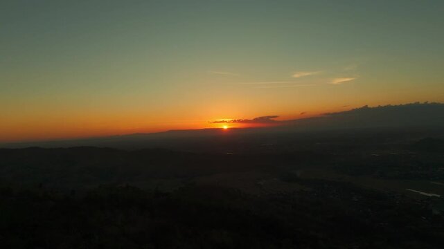 Aerial view of the golden sunset over the hills at HeHa Sky View in Kecamatan Patuk, Daerah Istimewa Yogya, Indonesia.