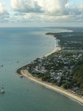 Aerial view of Ponta do Seixas showing the coastline, sandy beaches, lush green vegetation, and urban development in Joao Pessoa, State of Paraiba, Brazil.